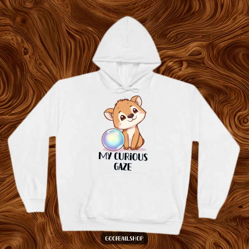 Funny Hoodie showing a curious animal tilting its head, captivated by the mesmerizing bounce of an iridescent ball.