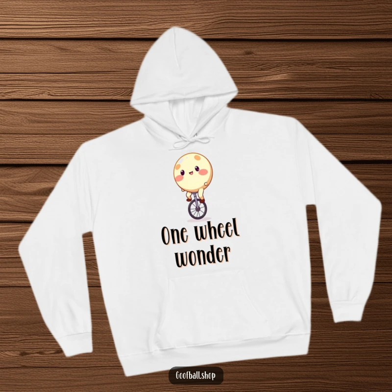Funny Hoodie depicting a round, brightly spotted character hilariously struggling to stay upright on a unicycle.